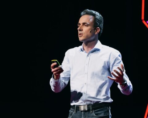 Header image showing TEDxVienna speaker Mathieu Morlighem on stage